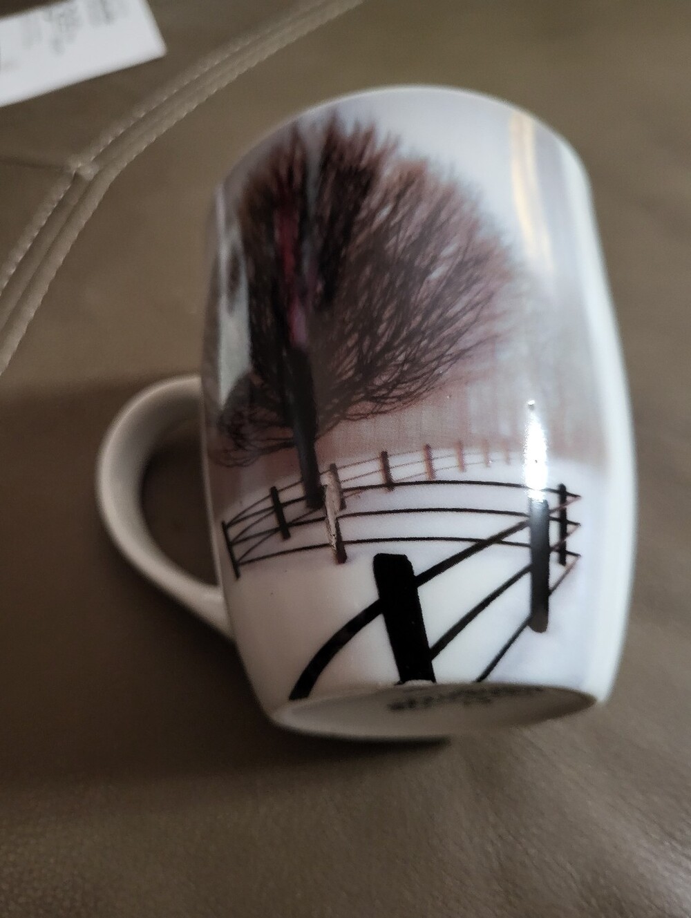 White Ceramic Mug with Black Fence and Brown Tree Design